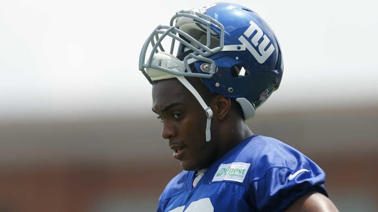 Devon Kennard of the Giants looks on during training camp...