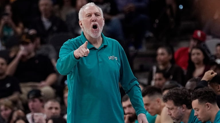 San Antonio Spurs head coach Gregg Popovich reacts to a...