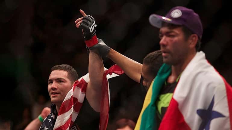 UFC middleweight champion Chris Weidman, from Baldwin, successfully defended his...
