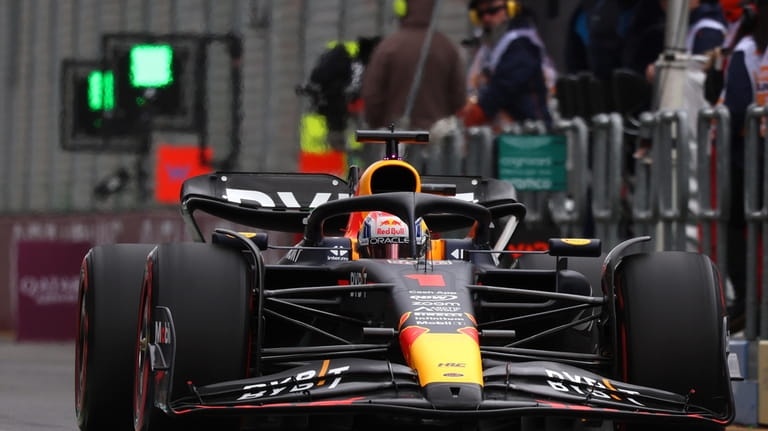 Red Bull driver Max Verstappen of Netherlands enters pit lane...