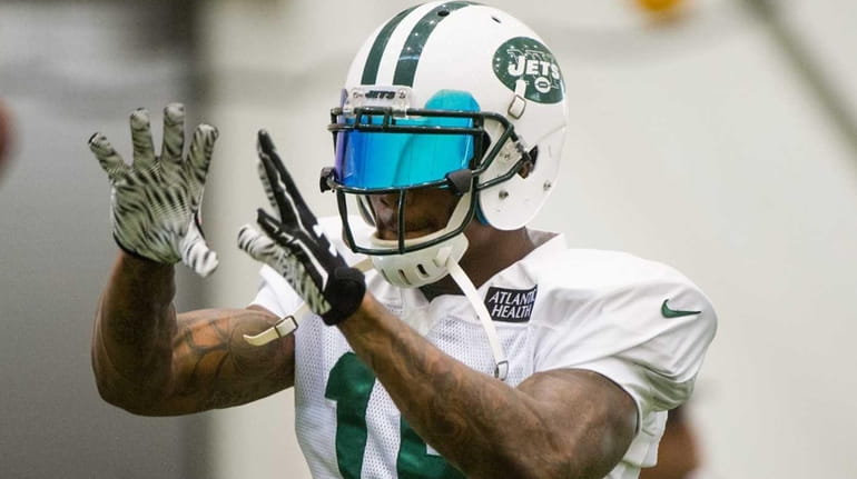 New York Jets wide receiver Brandon Marshall practices during training...