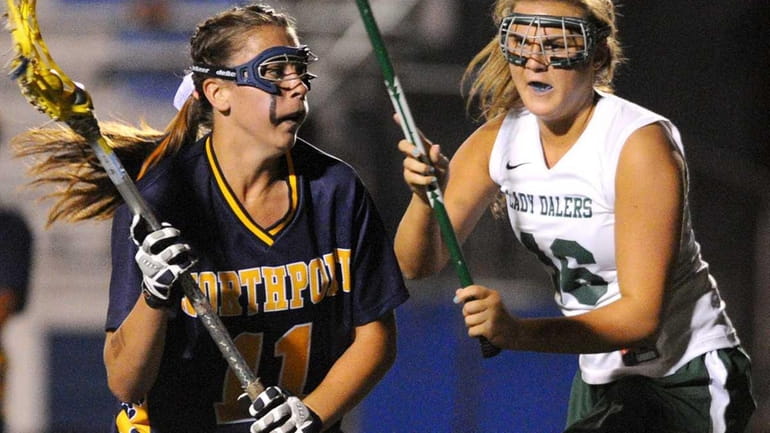 Northport's Shannon Gilroy, left, gets pressured by Farmingdale's Courtney McPartland...