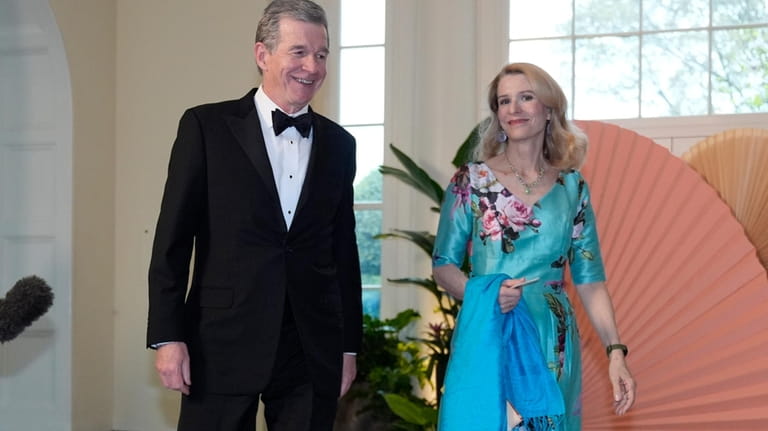 Roy Cooper, Governor of North Carolina and Kristin Cooper, arrive...