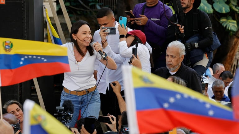 Opposition coalition presidential hopeful Maria Corina Machado speaks to supporters...