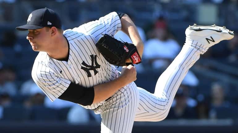 Yankees relief pitcher Michael King delivers against the Astros during...