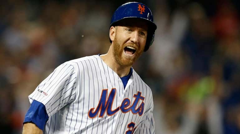 Todd Frazier of the Mets reacts after his fifth-inning grand slam...