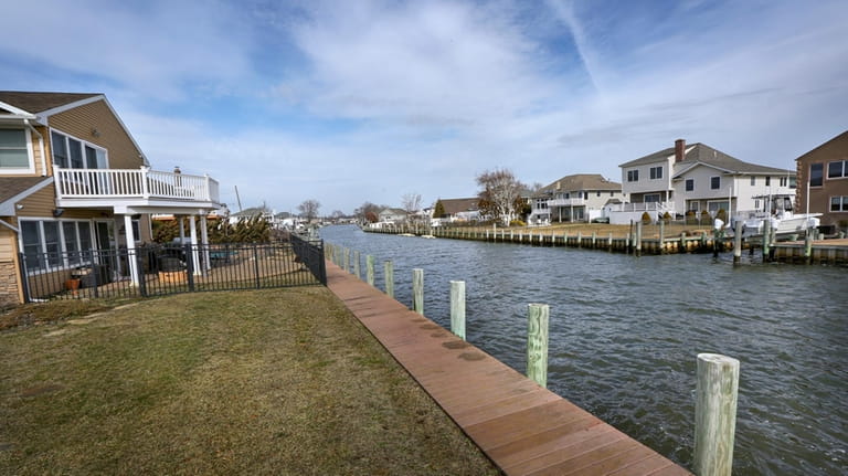 Homes along Keith Canal in West Islip, which lies off...