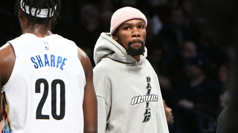Nets forward Kevin Durant looks during a timeout against the...