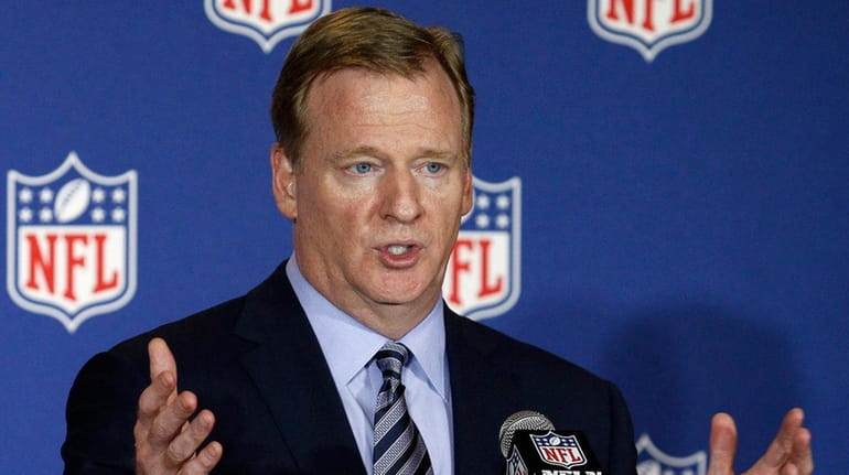 NFL commissioner Roger Goodell answers reporter's questions at an owner's...