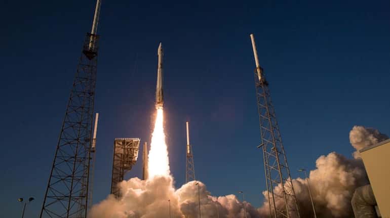 The United Launch Alliance Atlas V rocket carrying NASA's Origins,...