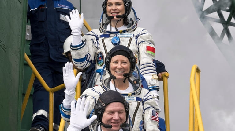 Belarus spaceflight participant Marina Vasilevskaya, top, Expedition 71 NASA astronaut...