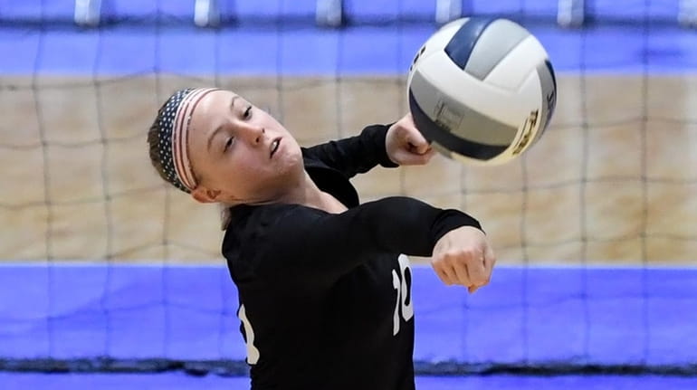 Cassidy Evans of Glenn hits the ball during a match...