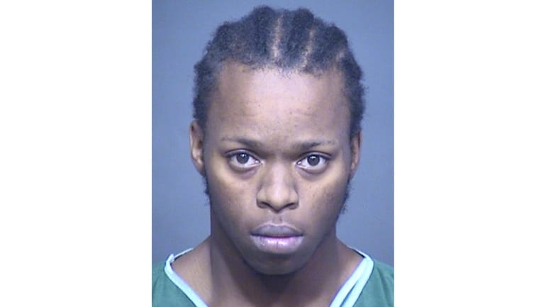 This booking photo provided by the Mesa, Ariz., Police Department...