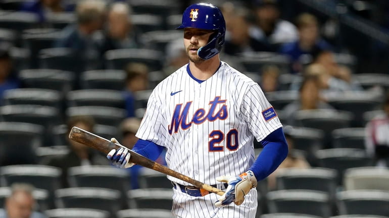 Pete Alonso of the Mets strikes out during the first inning...