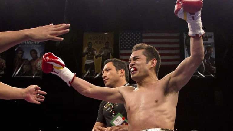 Nonito Donaire reacts after being declared the winner by technical...