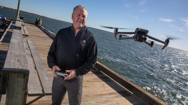 Mike Busch with his drone at Bellport Marina on March 8,...