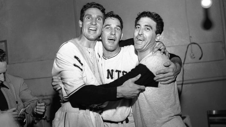 Bobby Thomson, Larry Jansen and Sal Maglie celebrate the New...