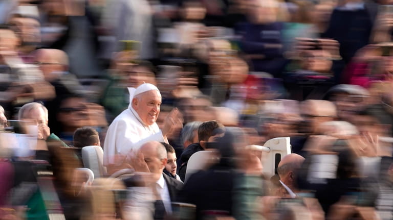 Pope Francis arrives for his weekly general audience in St....