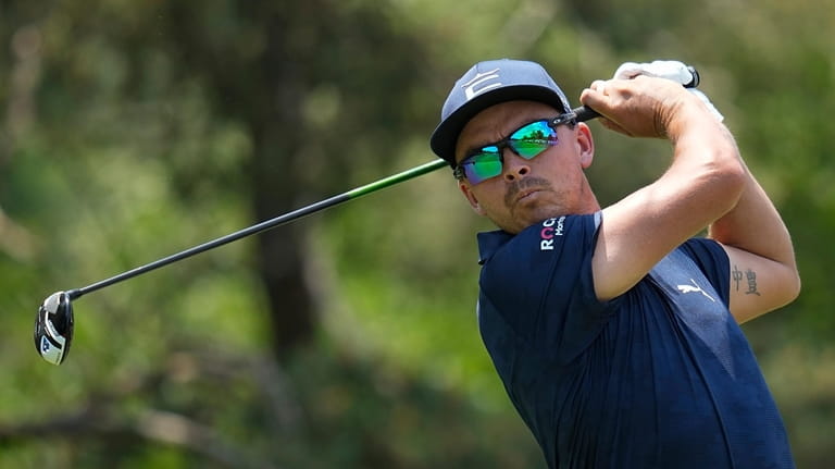 Rickie Fowler tees off on the second hole during the...