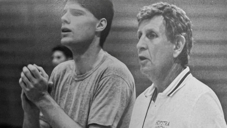 Don Laux, right, a basketball player, teacher and coach, was...