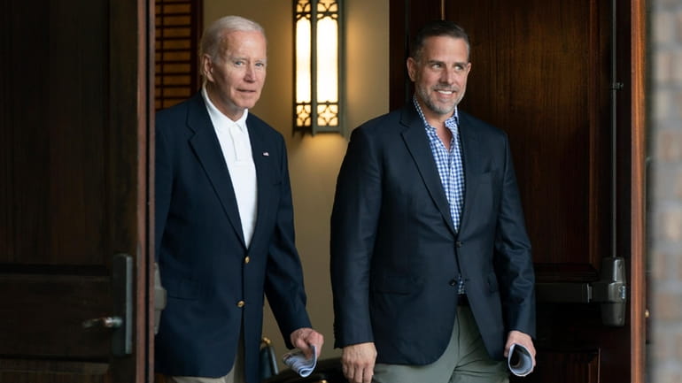 President Joe Biden and his son Hunter Biden leave Holy...