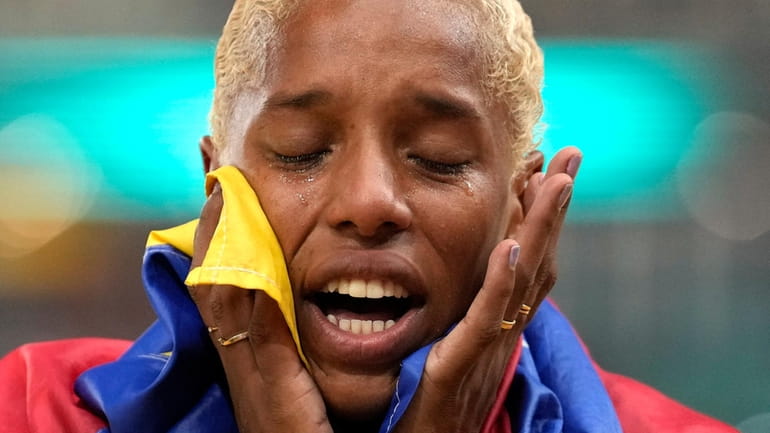 Yulimar Rojas, of Venezuela, reacts after winning the Women's triple...