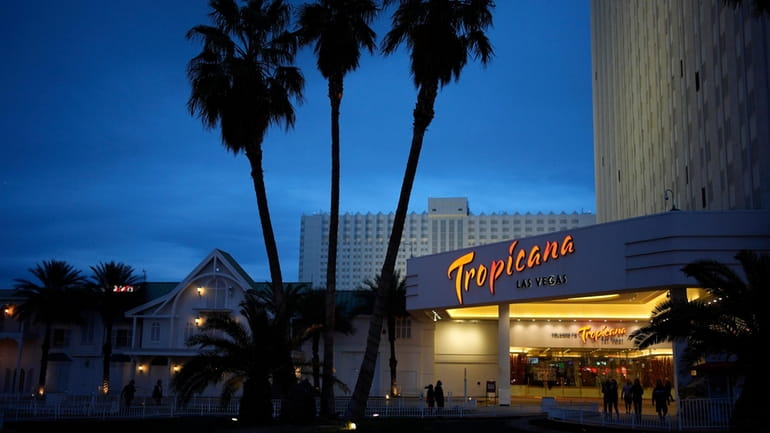People walk outside of the Tropicana hotel-casino Thursday, March 28,...