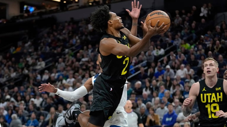 Utah Jazz guard Collin Sexton (2) goes up for a...