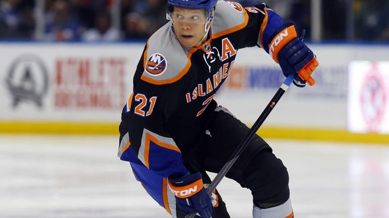 Kyle Okposo of the Islanders skates in the first period...
