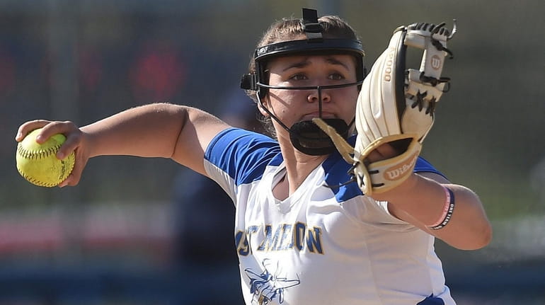 East Meadow's Amy Mallah throws to first base for an...