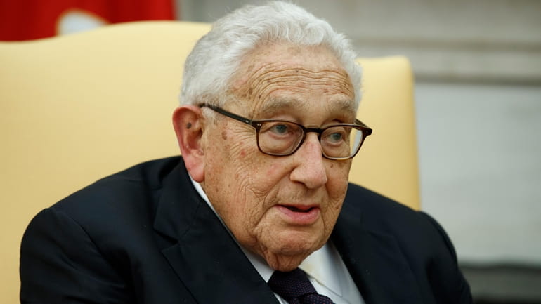 Former Secretary of State Henry Kissinger speaks during a meeting...