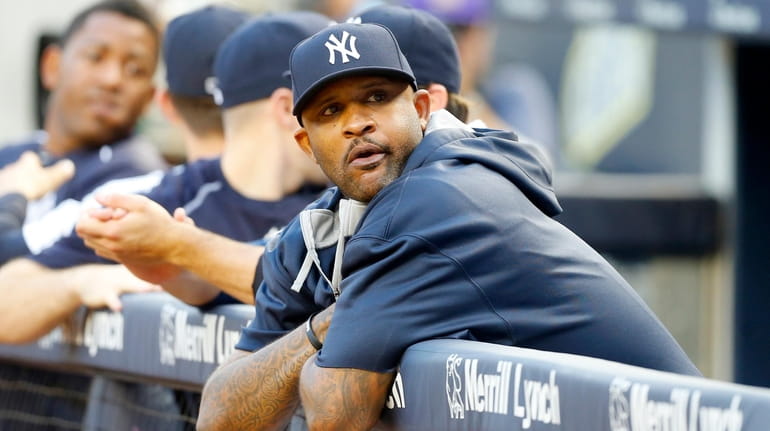 CC Sabathia of the New York Yankees looks on before a...