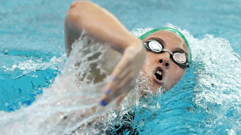 Massapequa's Molly Treble swims in a preliminary heat of the...
