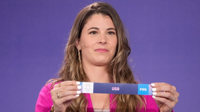Canadian soccer player Stephanie Labbe draws USA during the draw...