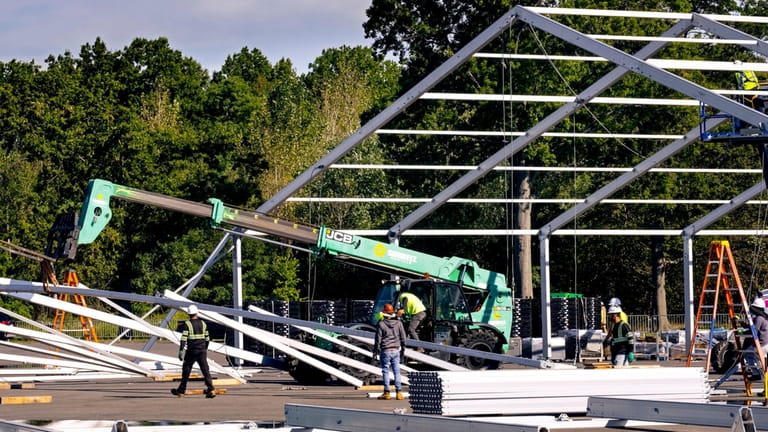 Construction on the tent structures last Tuesday at Orchard Beach...