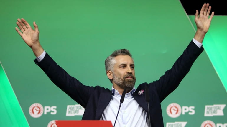 Socialist Party leader Pedro Nuno Santos waves to his supporters...