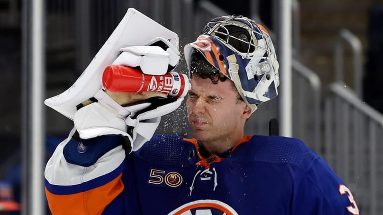 Ilya Sorokin of the New York Islanders cools off during the...