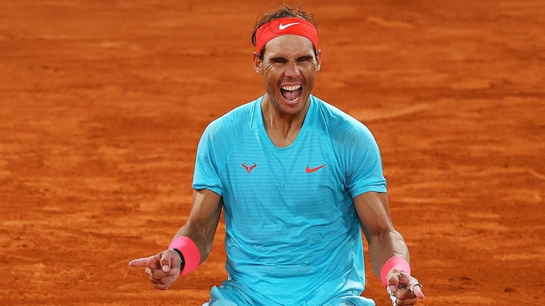 Rafael Nadal of Spain celebrates after winning championship point during...