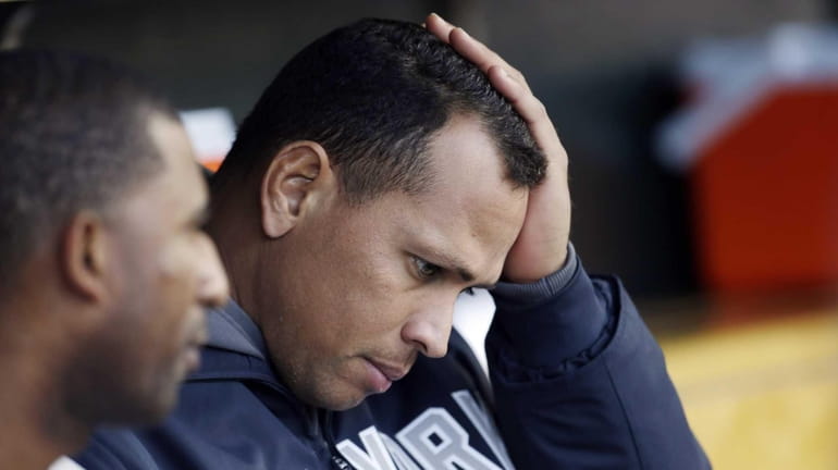 Alex Rodriguez watches from the bench during Game 4 of...