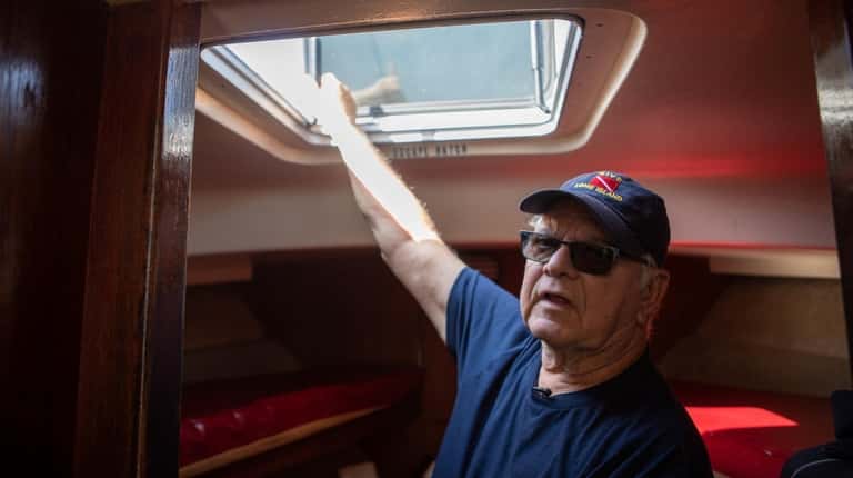 Frank Persico, captain of the for-hire boat Sea Hawk, demonstrates...