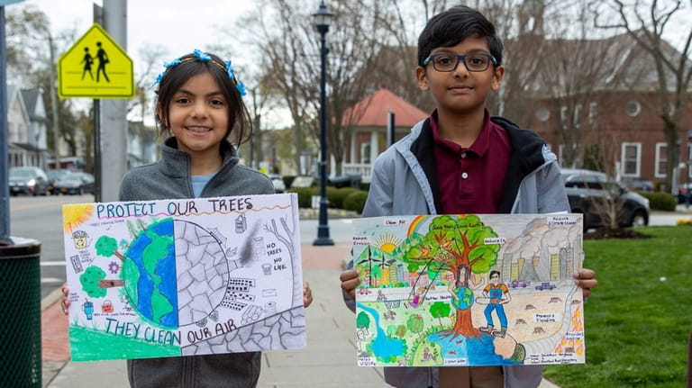 Fourth-grade student Valentina Waqar, left, won third place in a...