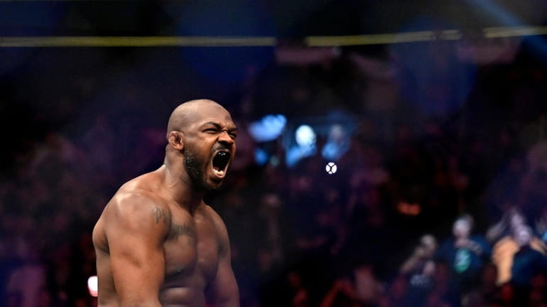 Jon Jones reacts after his victory over Ciryl Gane in...