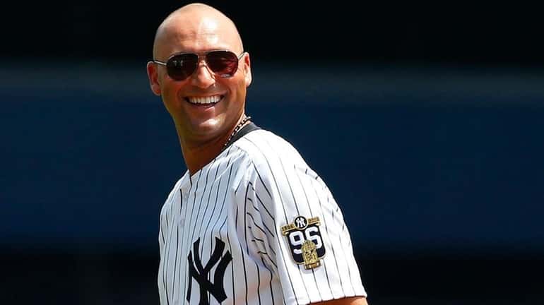 Former New York Yankee Derek Jeter smiles as he is...