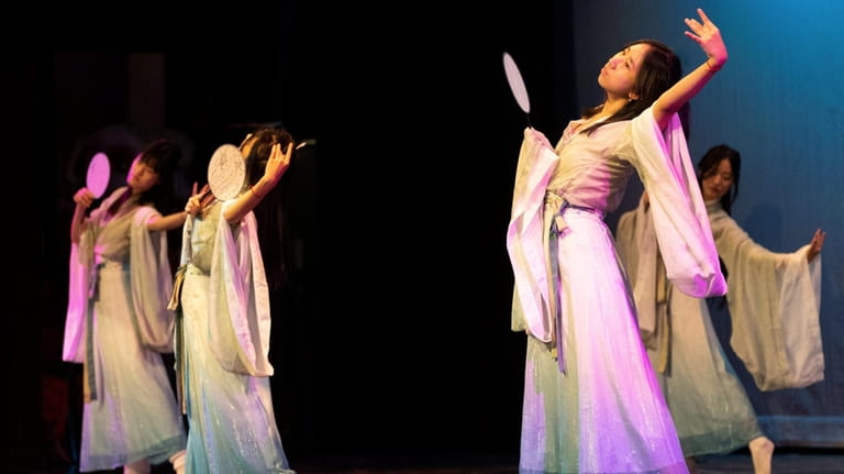 Students perform a traditional Chinese dance at Syosset High School...