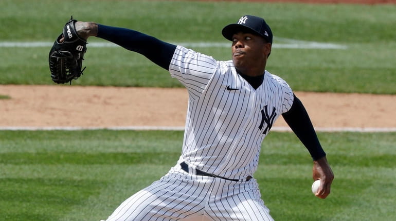 Aroldis Chapman of the New York Yankees closes out a...