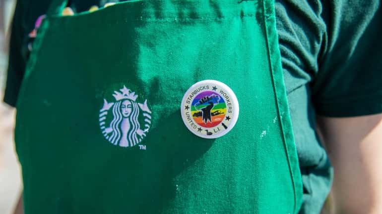 A Starbucks employee wears a Workers United pin.