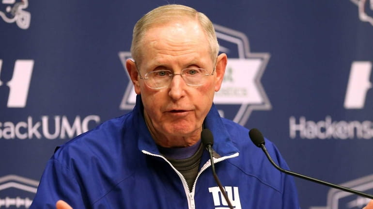 Giants Head Coach Tom Coughlin talks to media before practice...