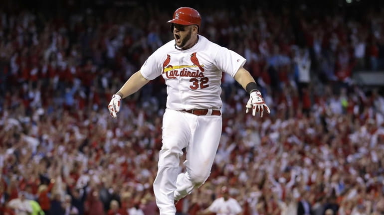 St. Louis Cardinals first baseman Matt Adams celebrates after hitting...