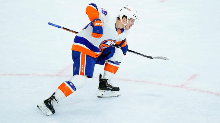 Islanders' Anthony Beauvillier celebrates after scoring the game-winning goal during...