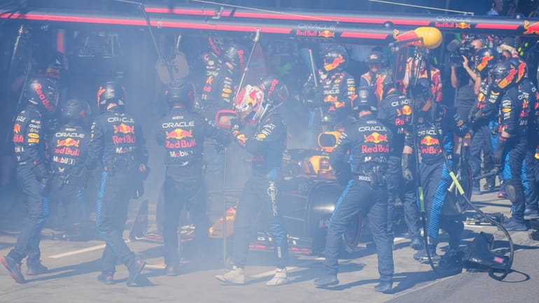 Red Bull driver Max Verstappen of the Netherlands walks from...